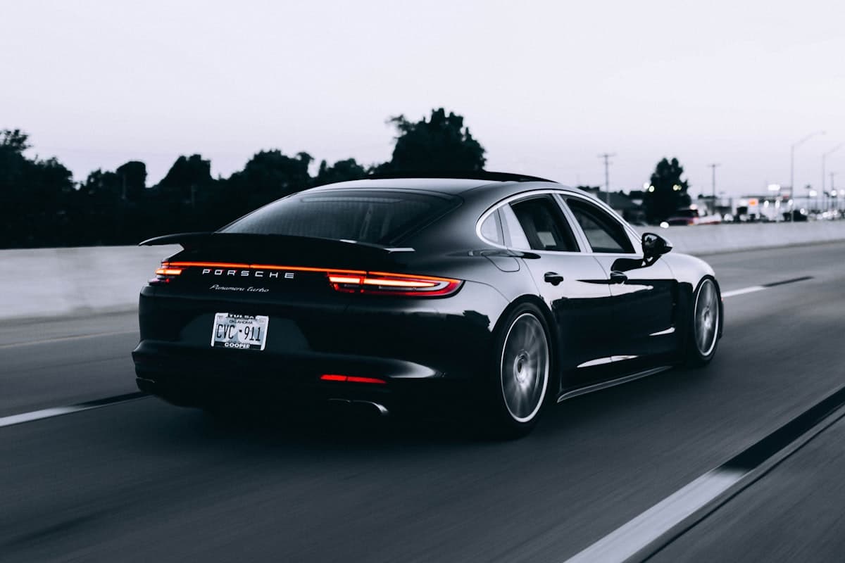 A car driving on the highway at dusk