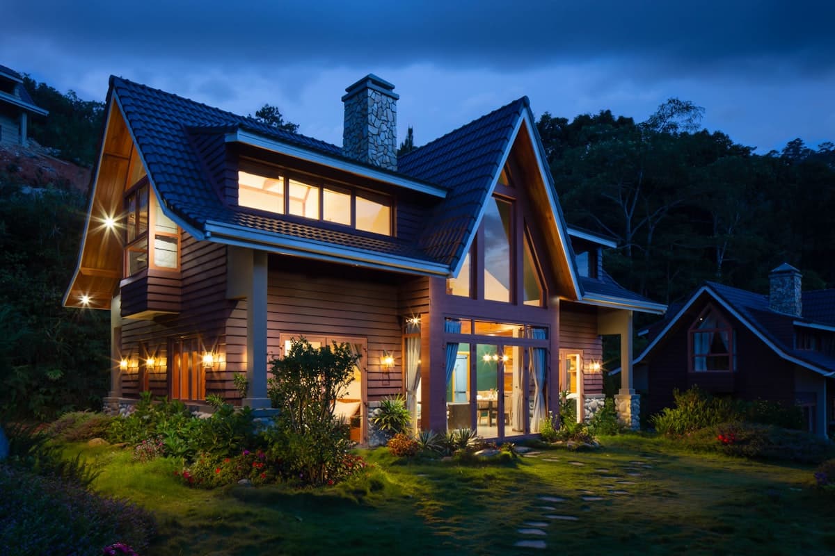 A warmly lit home at twilight